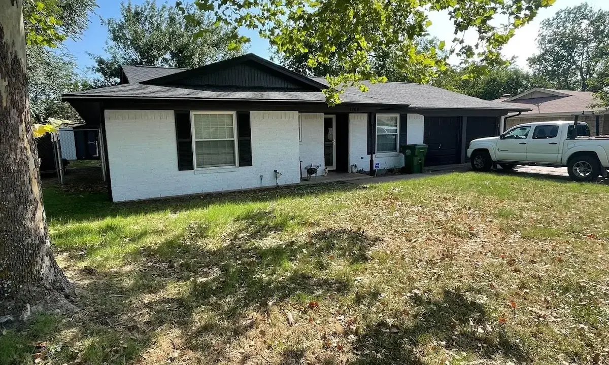 Professional roofing crew working on a residential roof in Mexico